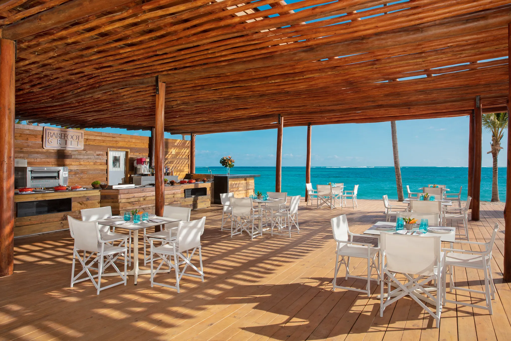 Barefoot Grill at Dreams Flora Resort & Spa featuring a relaxed beachfront setting with casual seaside dining and ocean views.