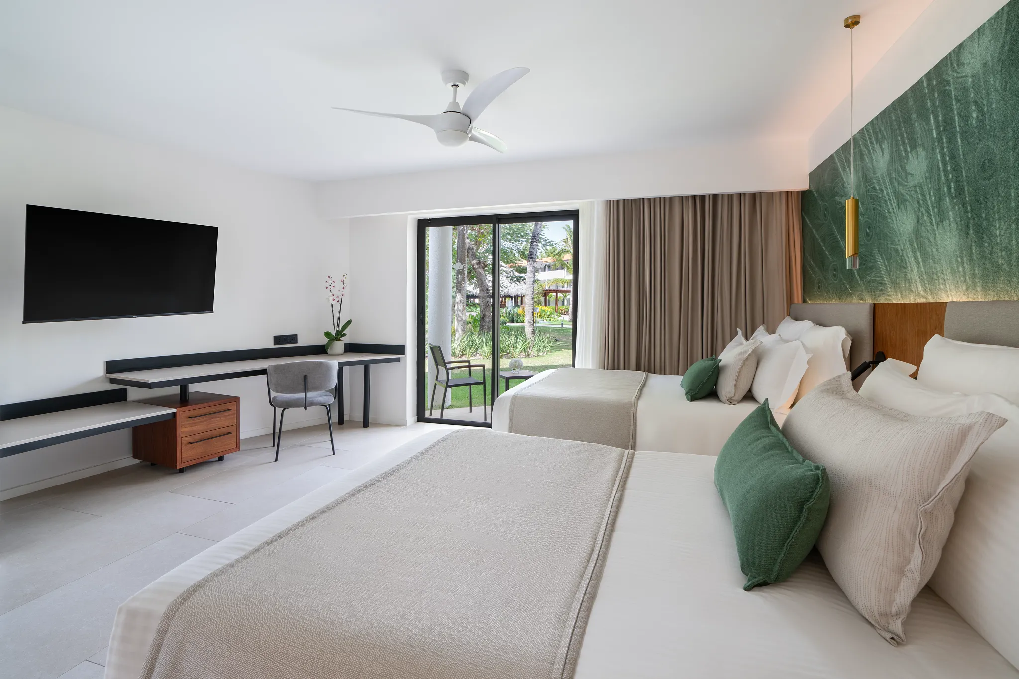 Deluxe Room with two double beds and garden view balcony at Dreams Flora Resort & Spa.