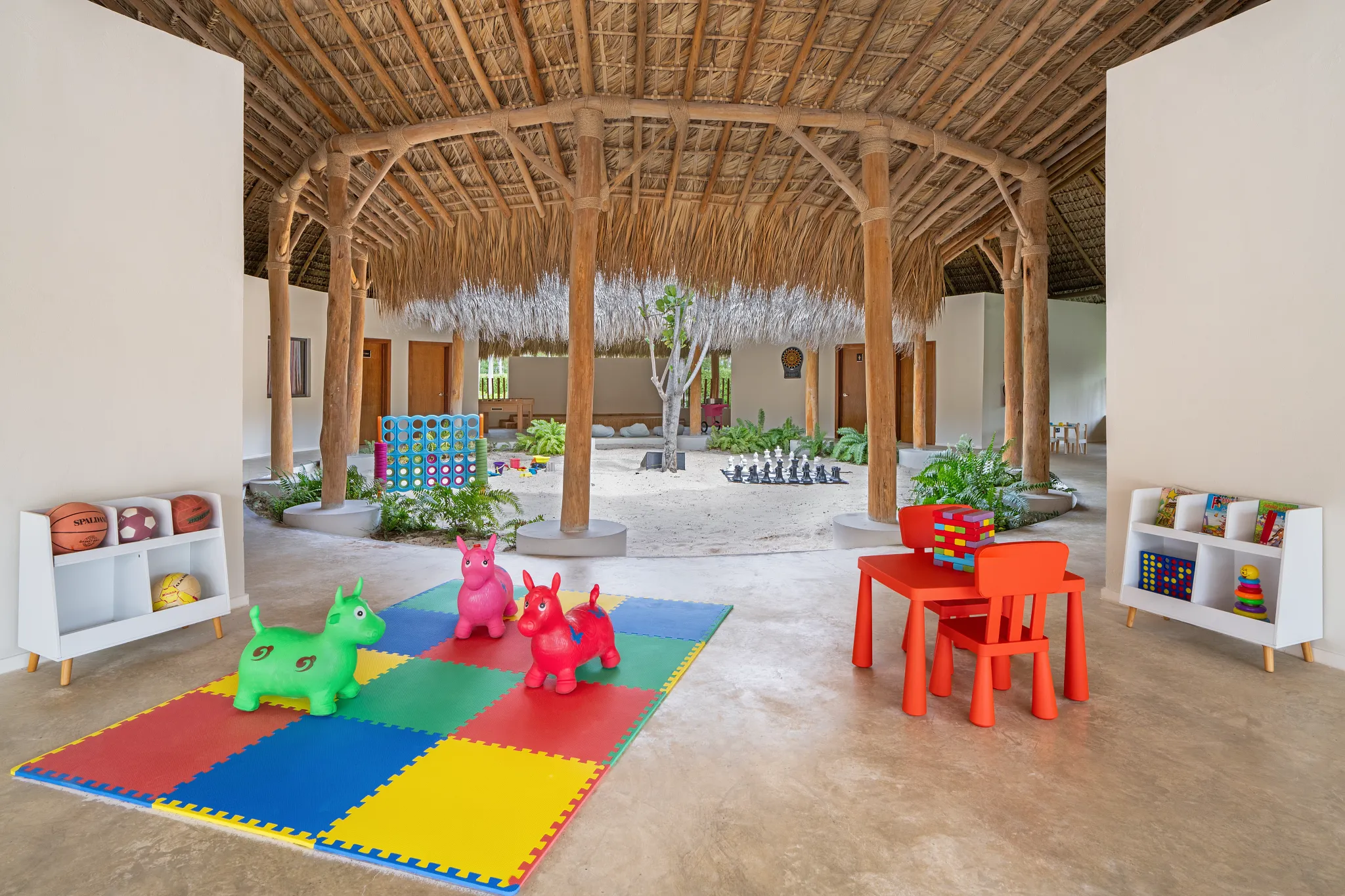 Outdoor kids club area with shaded play space and games at Dreams Flora Resort & Spa Punta Cana