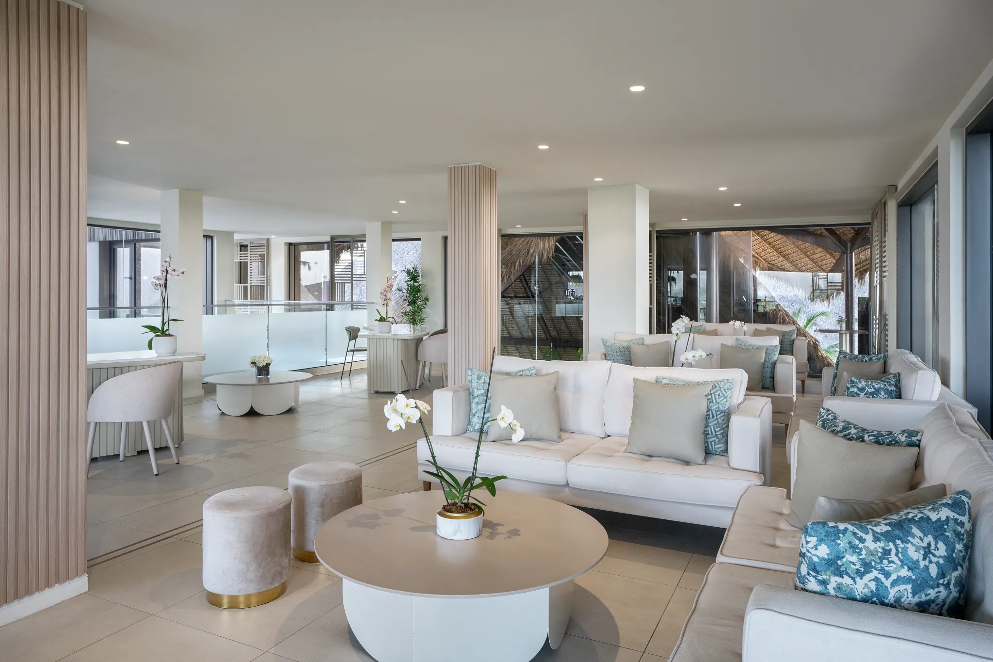 Elegant preferred club lobby lounge with sofas and modern decor at Dreams Flora Resort & Spa Punta Cana.