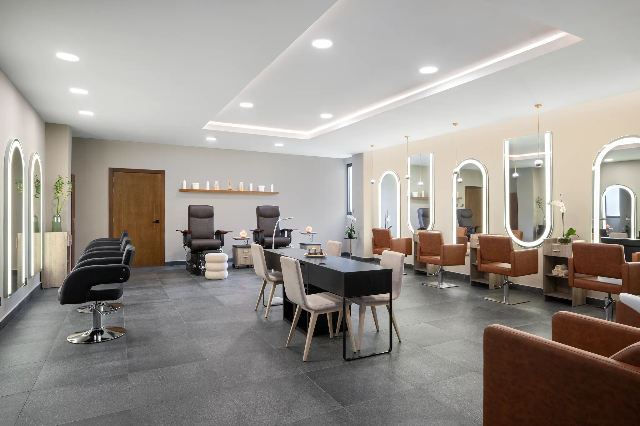 Salon with styling chairs, mirrors, and pedicure stations at Dreams Flora Resort & Spa Punta Cana.
