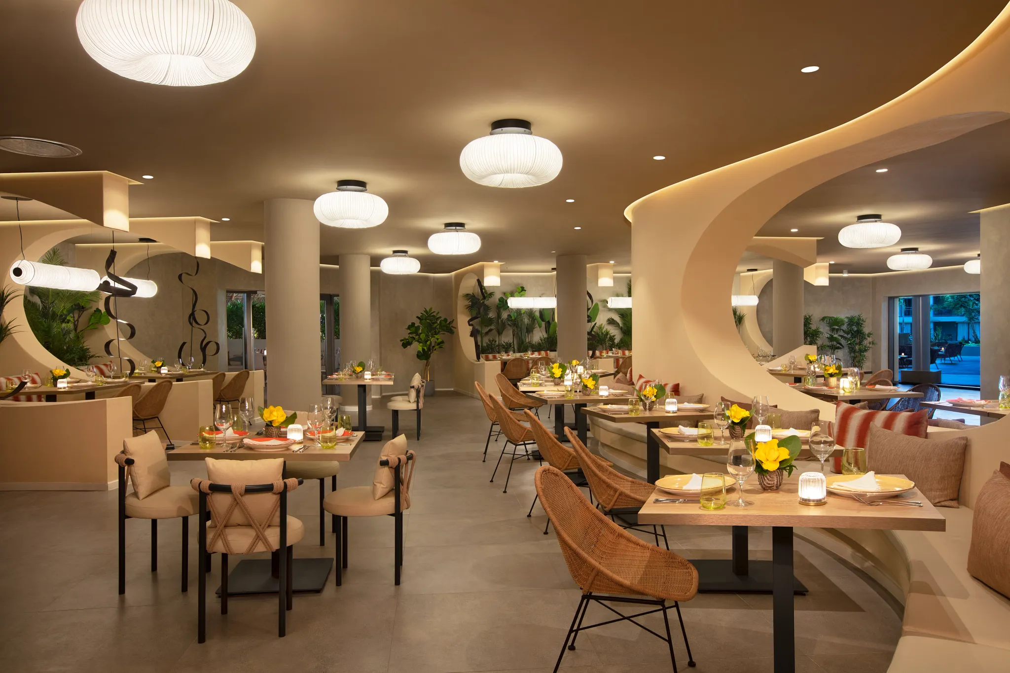 El Patio Mexican restaurant at Dreams Flora Resort & Spa featuring elegant dining space, warm lighting, modern décor, and intimate seating.