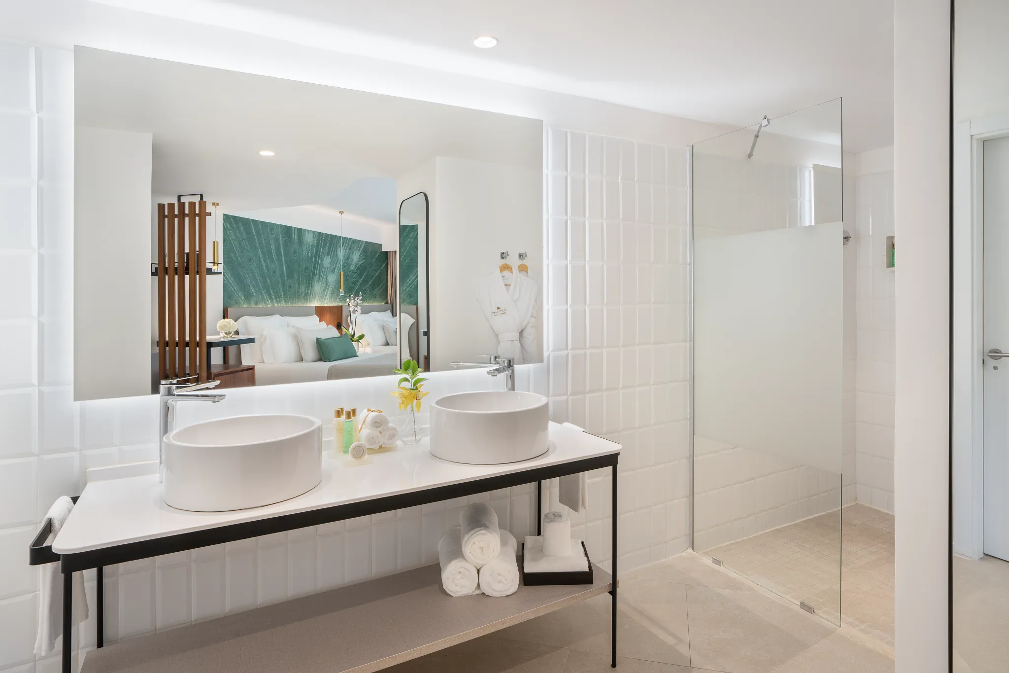Junior Suite Family Room bathroom with double sinks and walk-in rain shower at Dreams Flora Resort & Spa.