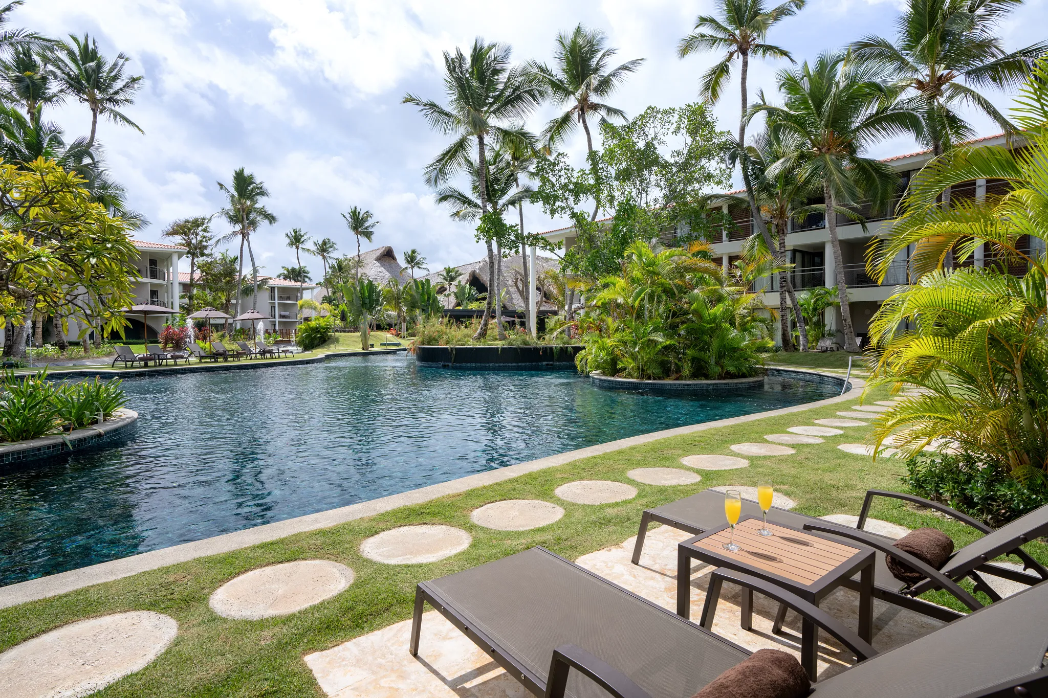 Junior Suite Swim Up terrace with loungers and direct pool access at Dreams Flora Resort & Spa Punta Cana.