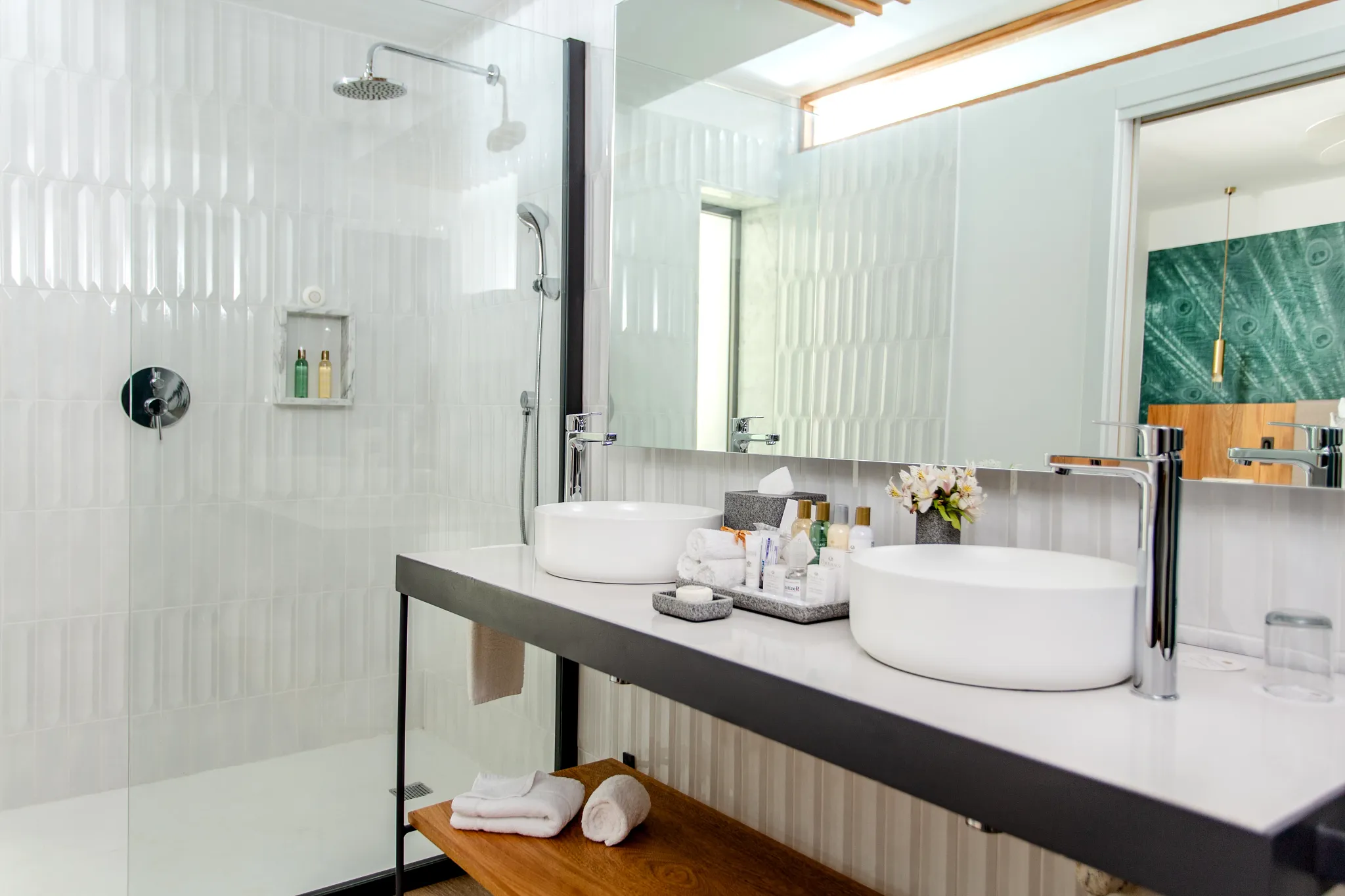 Preferred Club Junior Suite Ocean View bathroom with dual sinks and glass walk-in shower at Dreams Flora Resort & Spa.