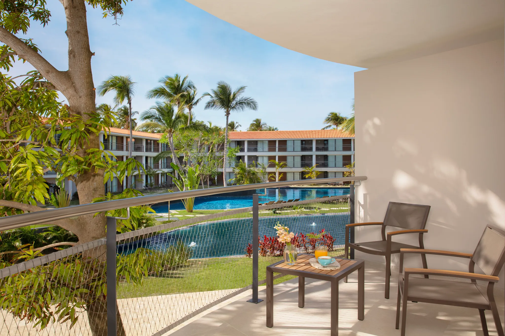 Preferred Club Junior Suite Pool View balcony overlooking pool at Dreams Flora Resort & Spa.