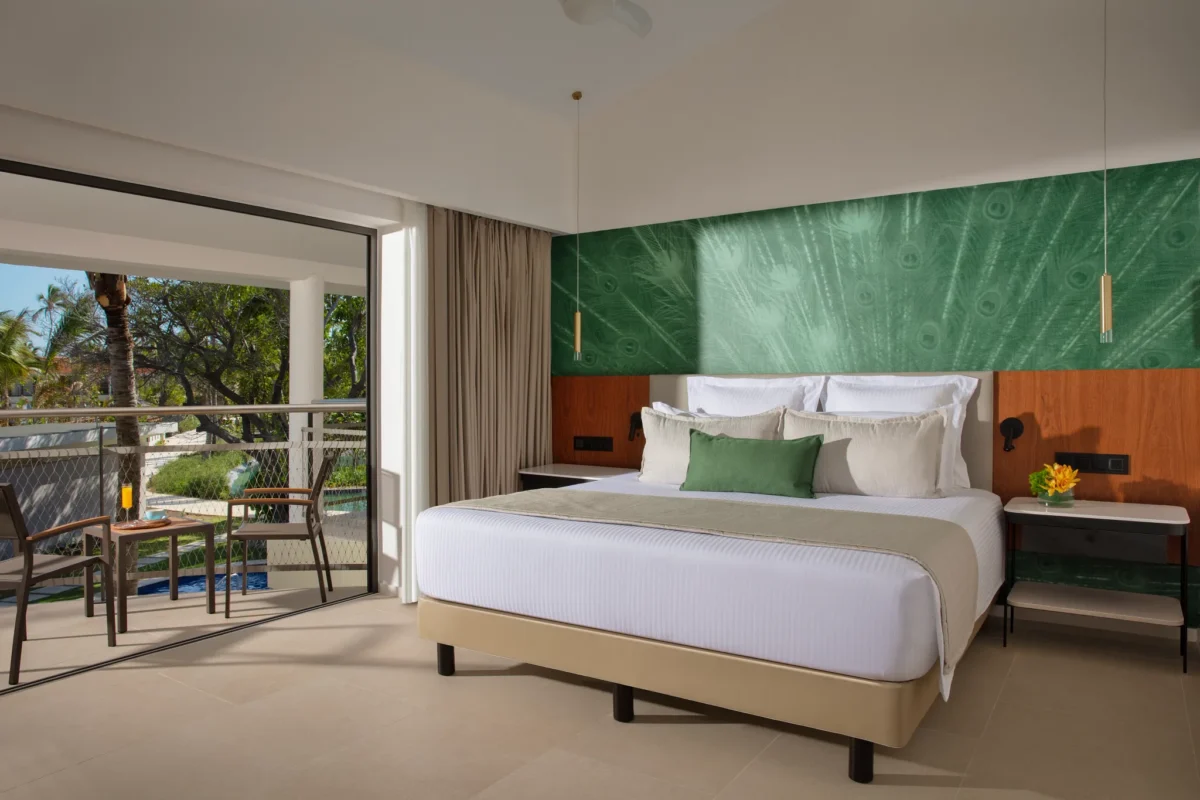 Preferred Club Master Suite Ocean Front king bedroom with balcony access at Dreams Flora Resort & Spa.