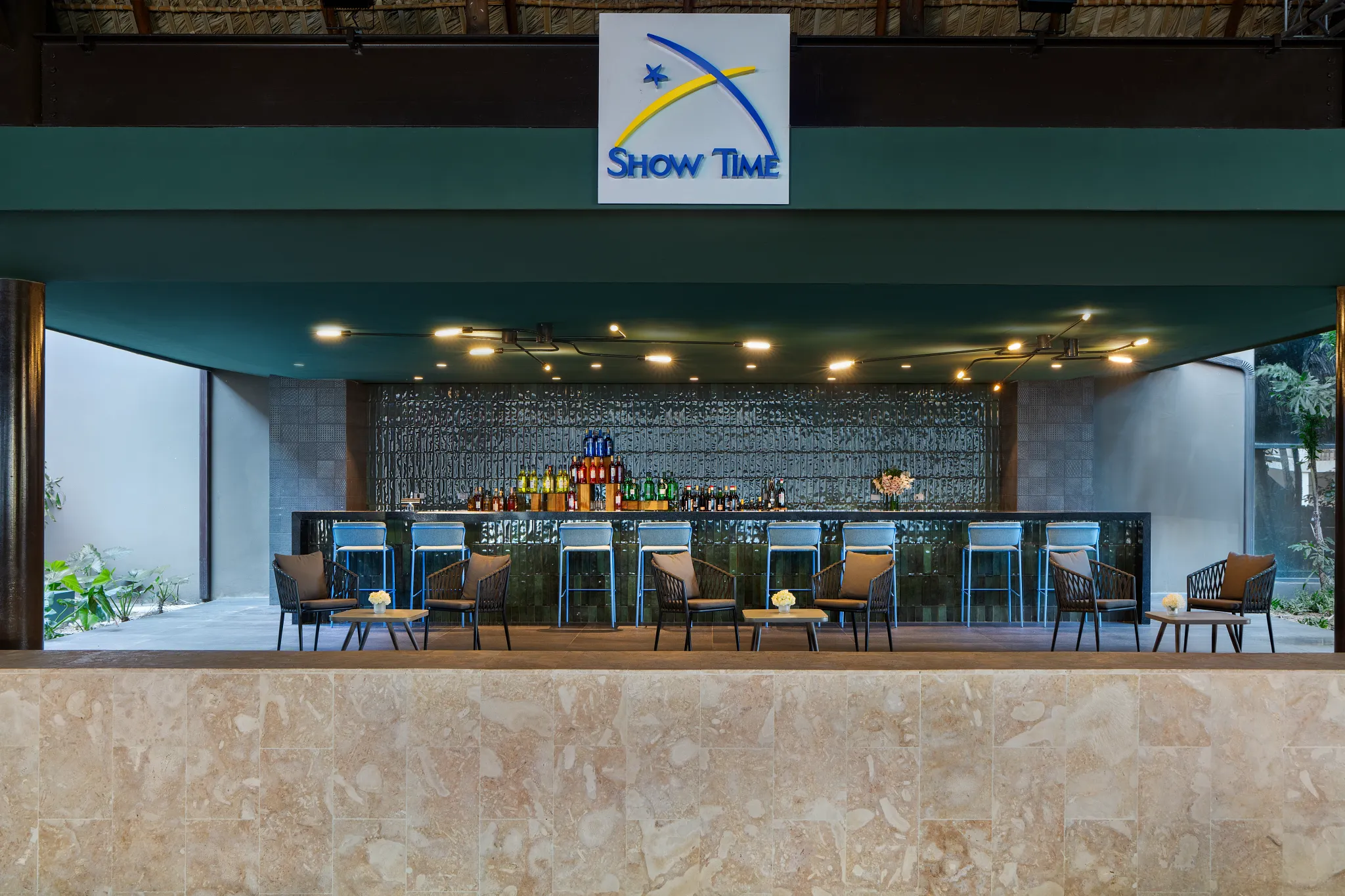 Showtime theatre bar at Dreams Flora Resort & Spa featuring a modern bar, lounge seating, and pre-show drinks atmosphere.